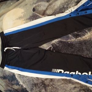 Beautiful pair of Reebok sweatpants with snap up bottoms excellent condition med